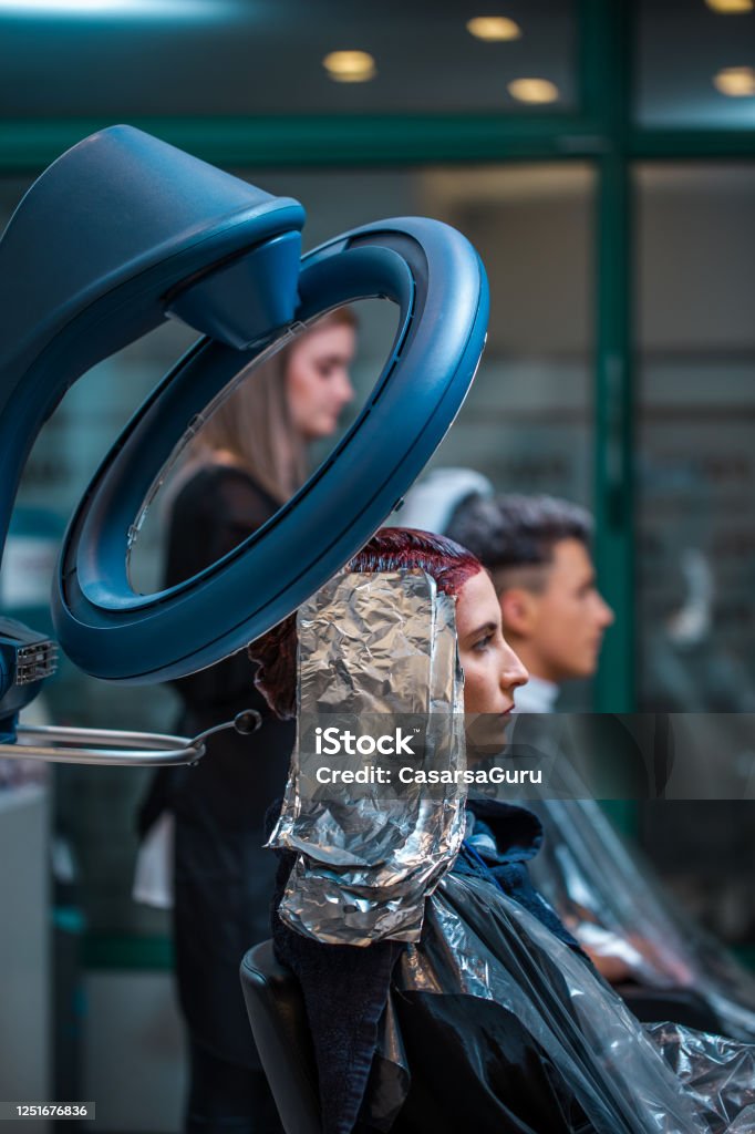 Customer In Hair Salon Sitting Under Electric Heater And Waiting For Hair  Dye To Stick And Dry Stock Photo - Download Image Now - iStock