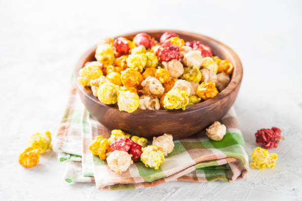 istock color popcorn in a bowl on a table, selective focus, copy space 1251677833