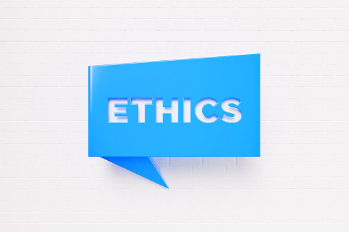 Ethics written blue chat bubble over white brick background. Horizontal composition with copy space. Ethics concept.