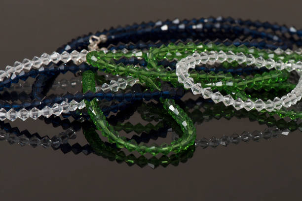 istock Beautiful elegant jewelry on a reflective black background 1251679974