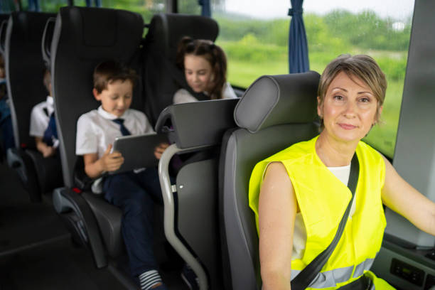 istock Female bus driver looks at camera confidently 1251680193