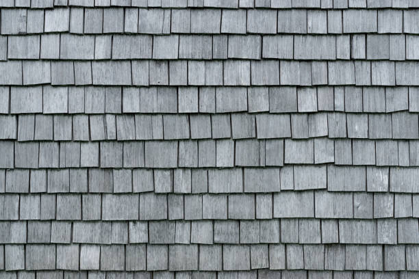 istock Shingle aged wooden background. Weathered shakes, nice colored texture. 1251684146