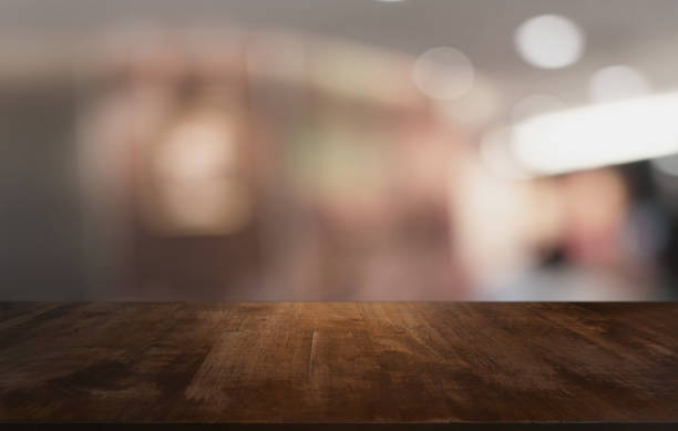 istock Wood Table Top in Blur Background room interior with empty copy space. 1251685315