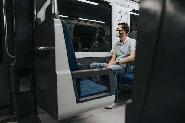istock Man wearing a face mask in the subway 1251687232