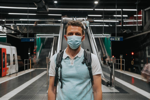 istock Man wearing a face mask in the subway 1251687813