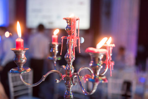 istock Candlestick with lighted candles and beautiful reflections photographed at wedding time 1251688057
