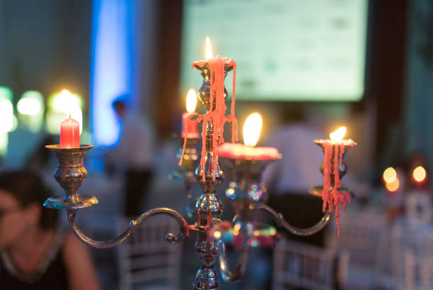 istock Candlestick with lighted candles and beautiful reflections photographed at wedding time 1251688101