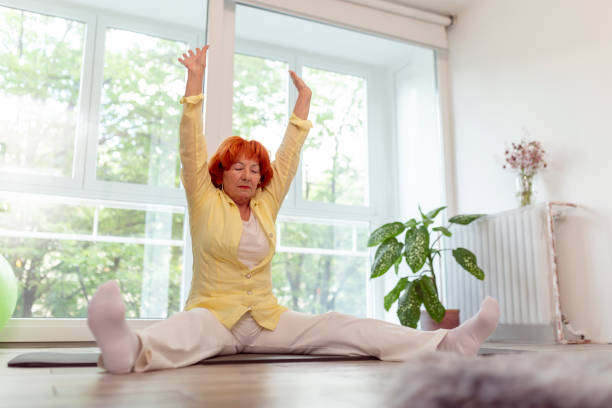 istock Senior woman stretching out 1251688694