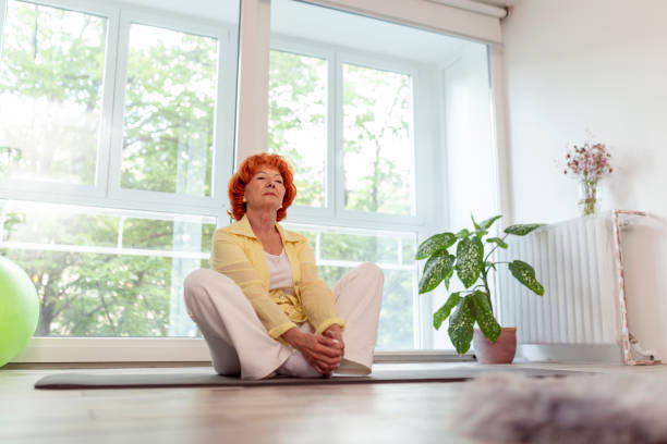 istock Senior woman doing stetch out exercises 1251688796