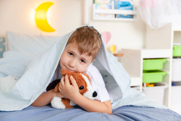 istock Toddler boy lying on the bed 1251688848