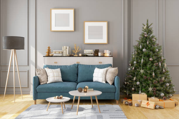 bilderrahmen, sofa und weihnachtsbaum im wohnzimmer - lichterkette dekoration fotos stock-fotos und bilder