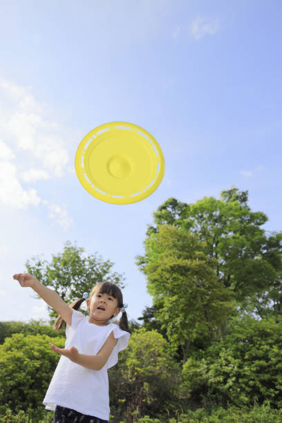 istock Japanese girl playing flying disc (5 years old) 1251692104