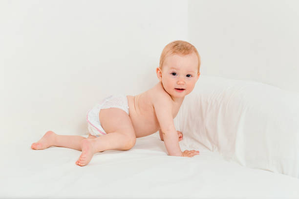 Cute baby boy in diapers on baby changing table - Buenos Aires - Argentina