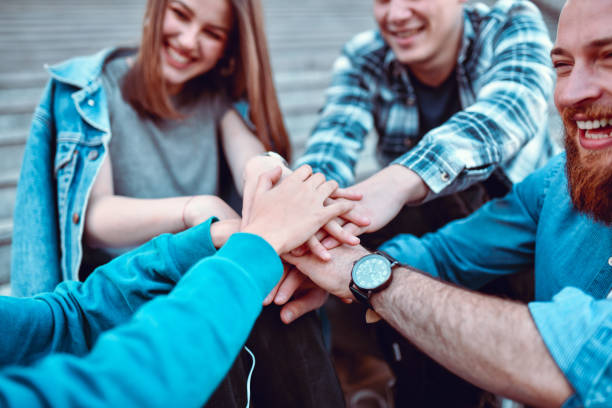 istock Friends Exchanging Team Spirit Outside 1251694337