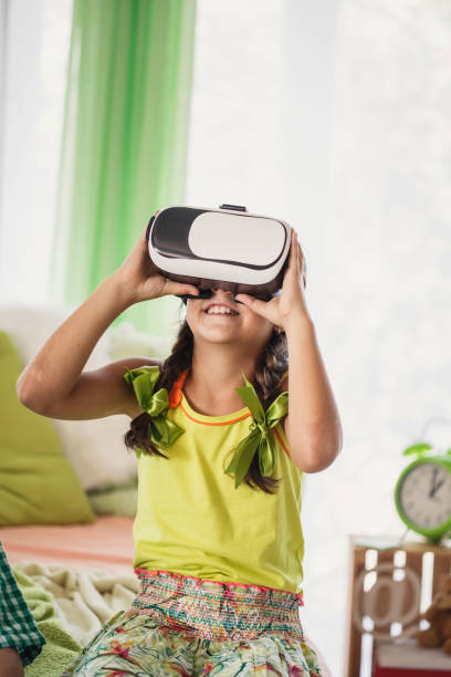 istock Girl with virtual reality simulator at home 1251694392