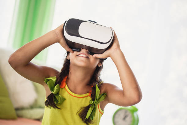 istock Girl with virtual reality simulator in her bedroom 1251694401