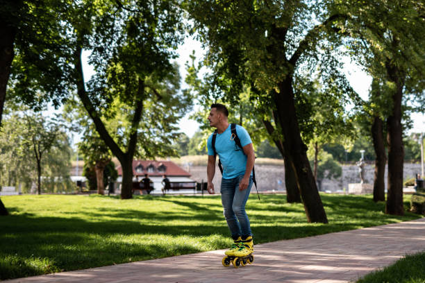 istock Man enjoys while rides inline skates in the city 1251698672