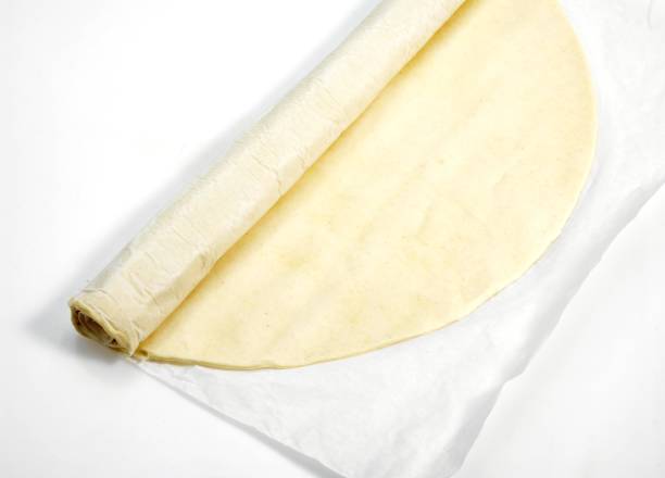 istock Puff or Flaky Pastry against White Background 1251700483