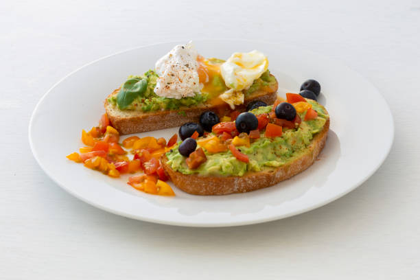 istock Tasty sandwich with poached egg and avocado 1251711492