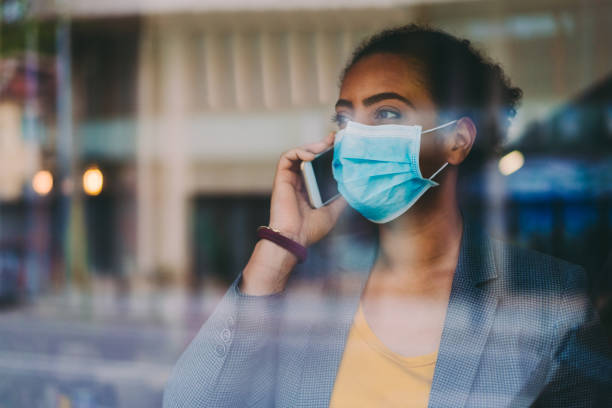 istock Businesswoman wearing protective face mask 1251711508
