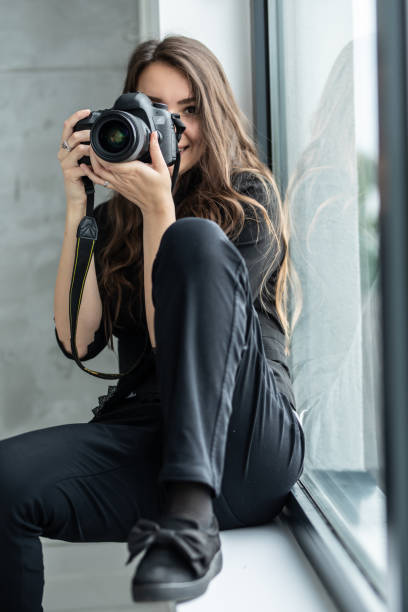 istock Female Photographer working in a studio 1251712620