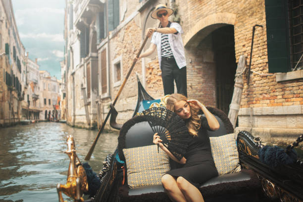 istock Young woman in gondola, Venice 1251712624