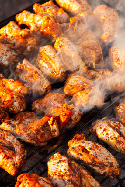 istock Chicken cooking on an outdoor grill 1251712869