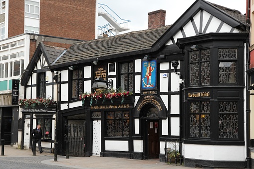 Exterior view of Ye Olde Man and Scythe pub in Bolton. As of 2011 there were more than 50 thousand pubs in the UK. This one is believed to be one of 10 oldest in the nation.