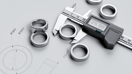 The quality control of part dimensions using calipers and technical drawings - perspective view