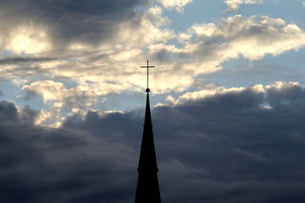 istock Church spire and clouds in Bonn, Germany 1251714483