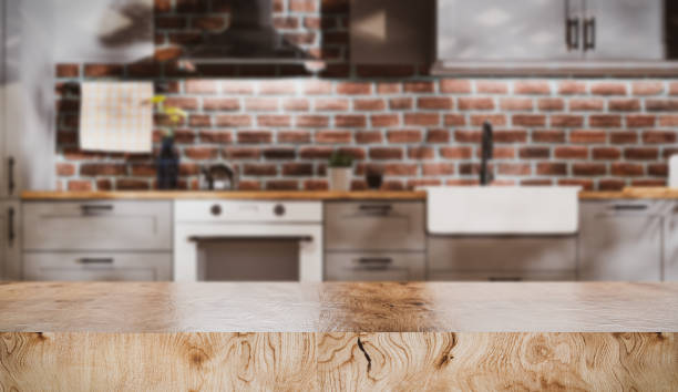 istock Empty kitchen table top on the background of Scandinavian style kitchen background 1251716530