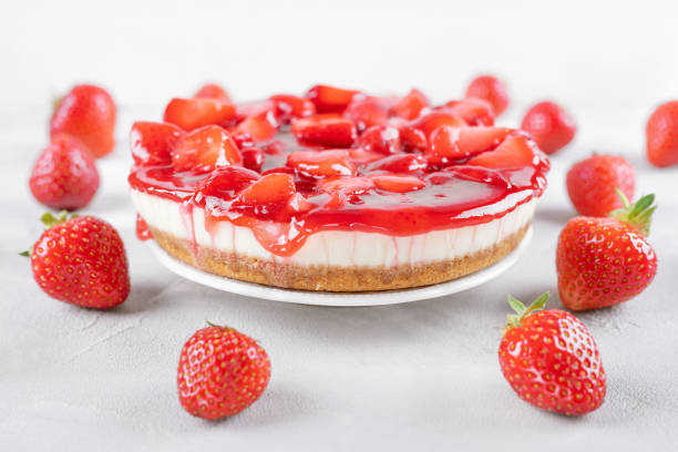 istock cheesecake with strawberry and fresh berries on gray table and white background 1251716799
