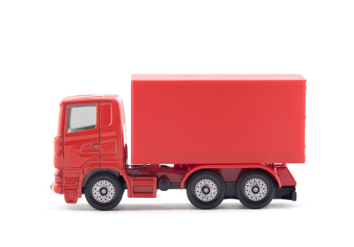 Red cargo delivery truck miniature isolated on white background with clipping path