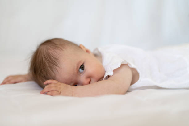istock Five month baby girl in bed 1251718329