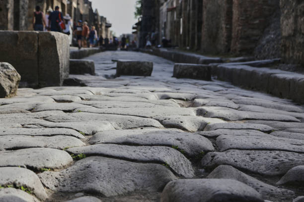 istock Ancient Roman cobblestone street 1251718461