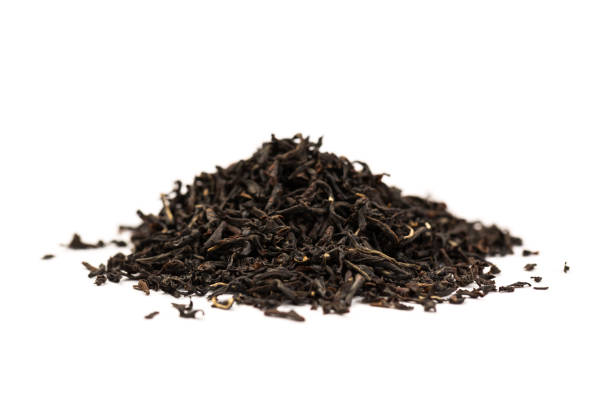 istock Fragrant Leaves of black premium dry tea on a white background 1251719792