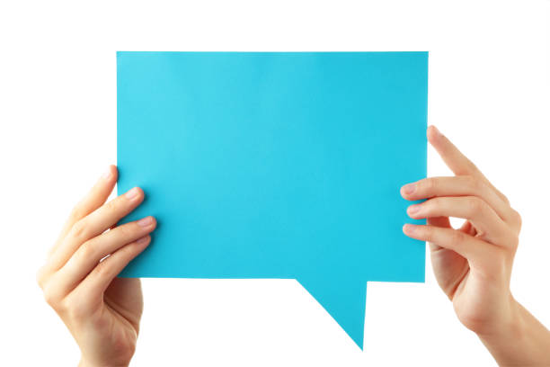 istock Hand holding an blue empty speech bubble isolated on white background 1251719876