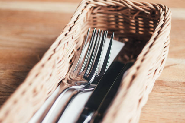 istock Table appointments on the table. Knife, fork, napkin, cafe, table, decoration. Fork and knife in the basket on the table. 1251720912
