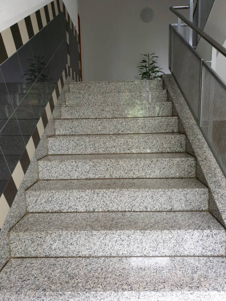 istock Modern stairwell hallway with tiles and granite 1251722306