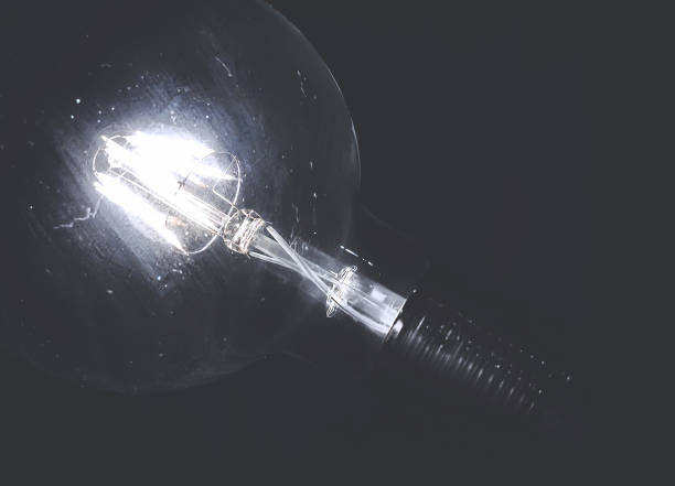 istock Vintage bulb on the dark background 1251727004