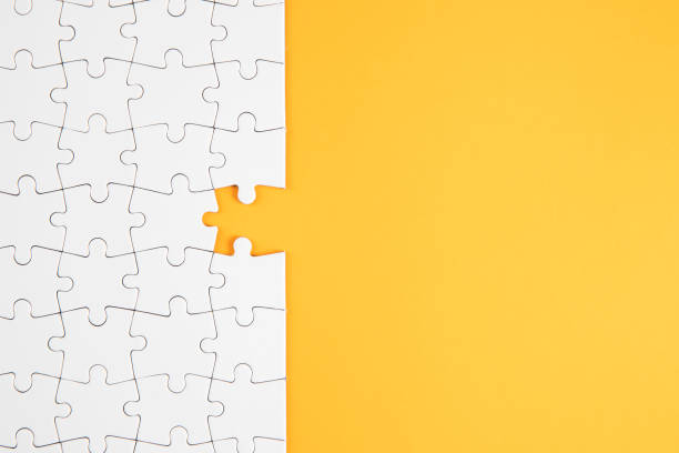 istock Jigsaw Puzzle on Yellow Background 1251727153