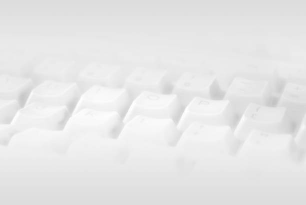 istock Close-Up Of Computer Keyboard Over White Background with selective focus 1251729984