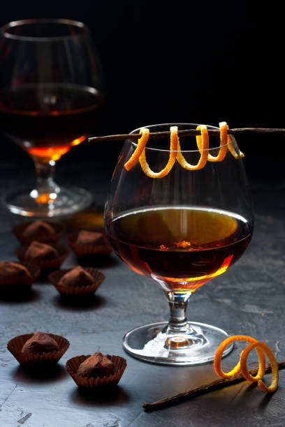 istock Whiskey or cognac  in  glass with  truffles candy on  dark background 1251730168