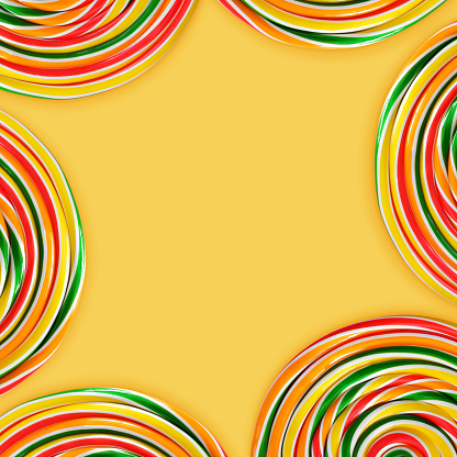 Colorful spiral candies on yellow background (clipping path)
