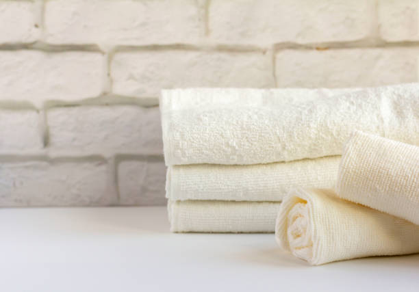 istock A stack of clean white Terry towels on a light background 1251730952