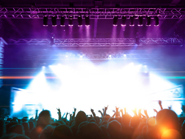 istock Concert hall with people silhouettes 1251731351