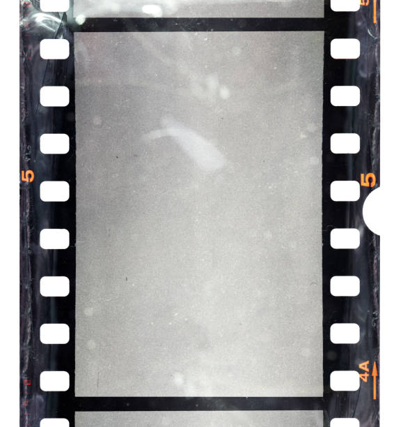cool photo placeholder, real macro photo of 35mm film strip. blank 35mm film material with empty cell or frame, macro photo, no scan, just blend in your work here. 16mm film motion picture camera photos stock pictures, royalty-free photos & images