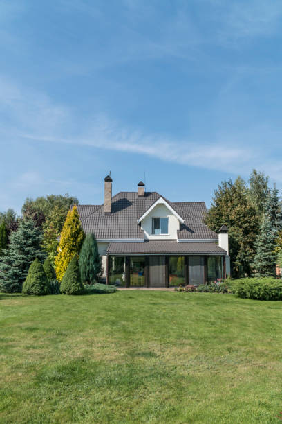 istock a private house and its garden under blue sky 1251737009