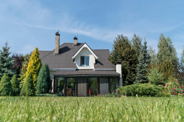 istock a private house and its garden under blue sky 1251737013