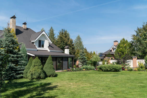 istock a private house and its garden under blue sky 1251737019